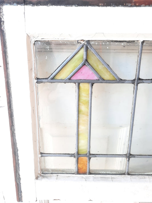 Arts and Crafts Style Stained Glass Window with Pink and Yellow Arrow Design