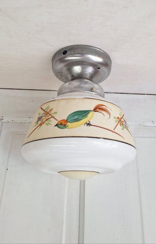 Decorative ceiling light with a bird design on a white background