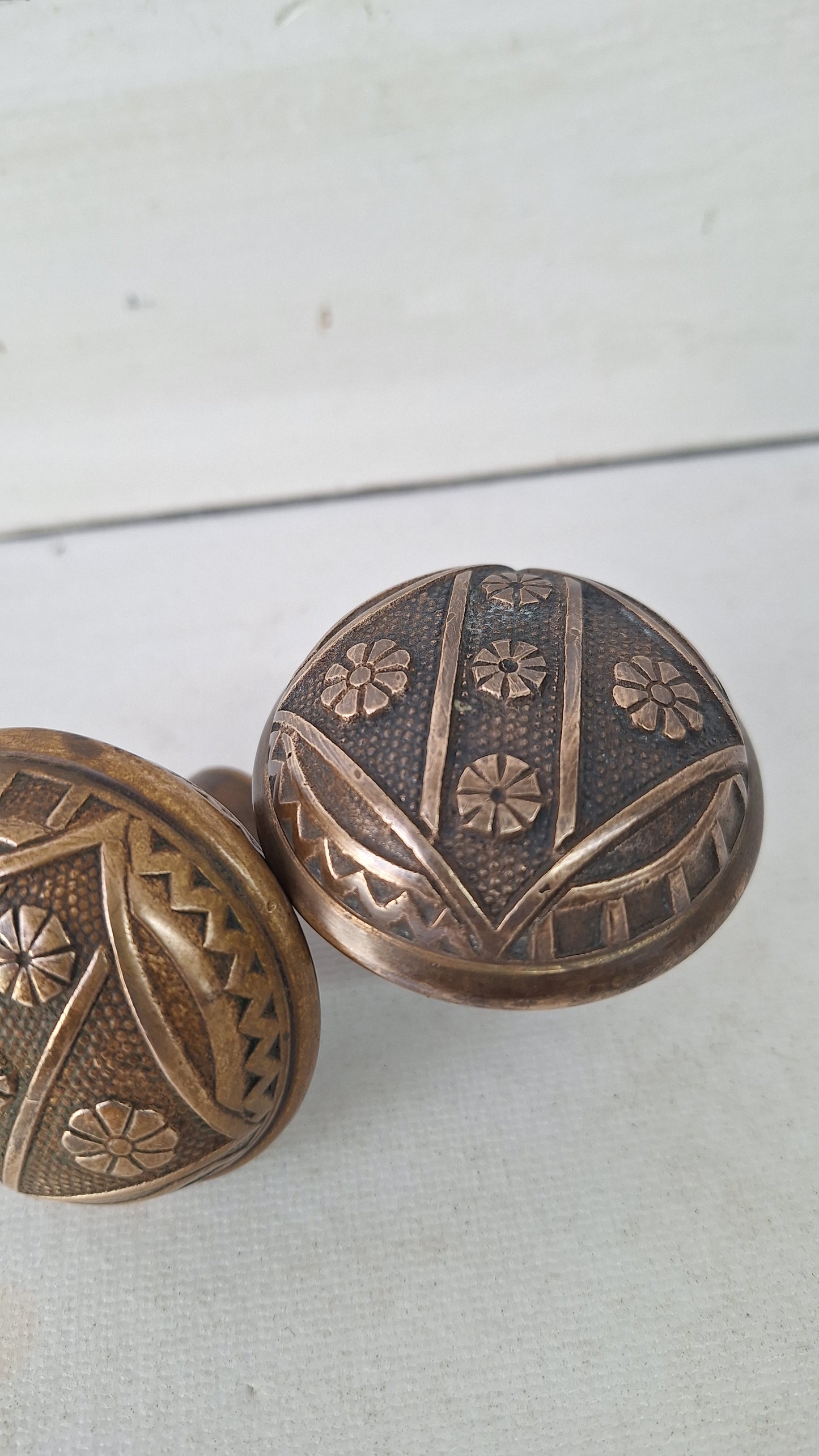 Two FC Linde Antique Bronze Doorknobs: Floral Eastlake Design