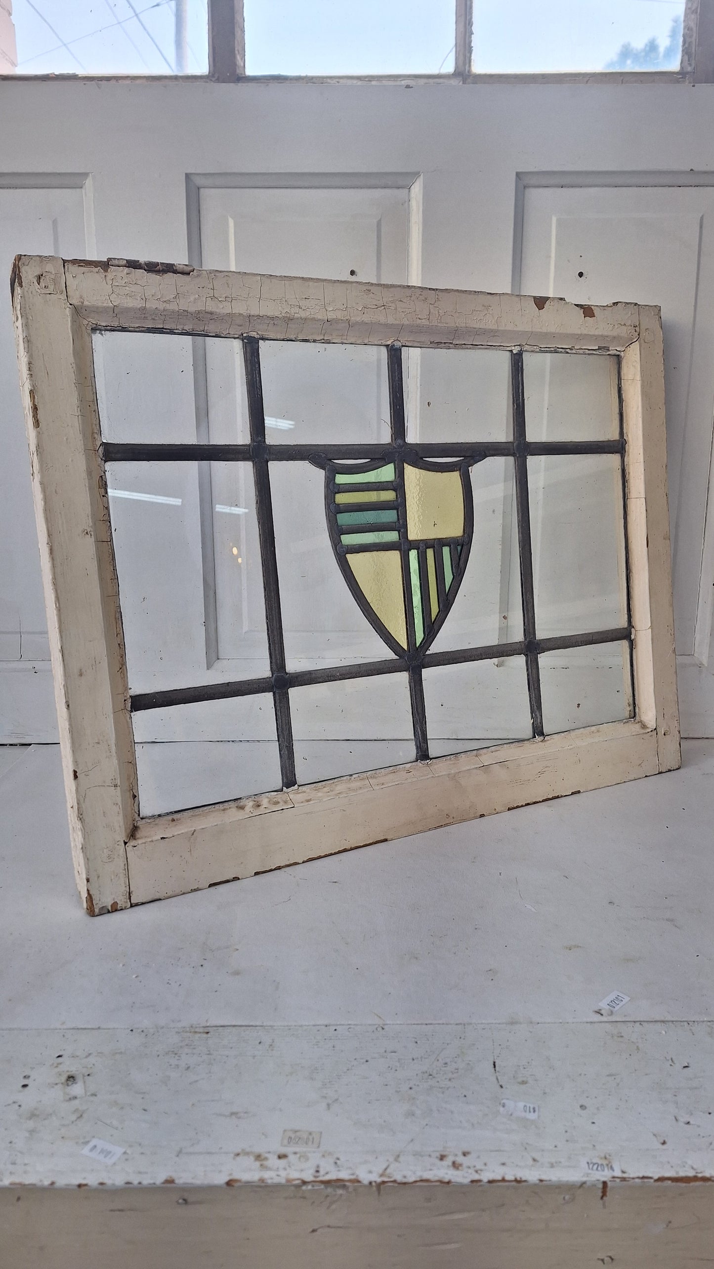 Antique Stained Glass Window: Yellow & Blue Shield Design
