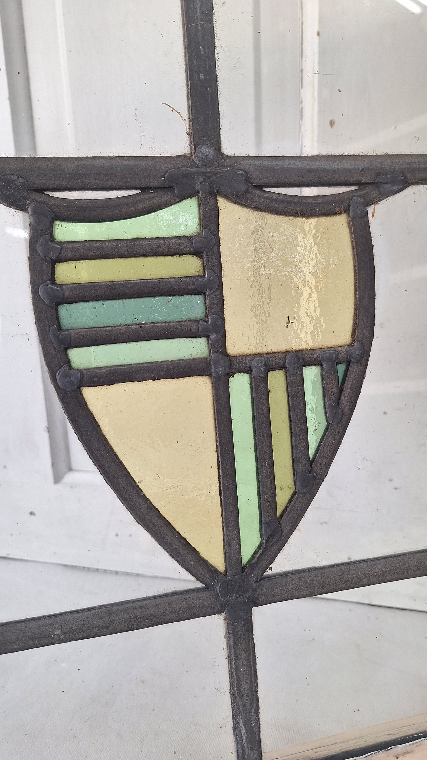 Antique Stained Glass Window: Yellow & Blue Shield Design