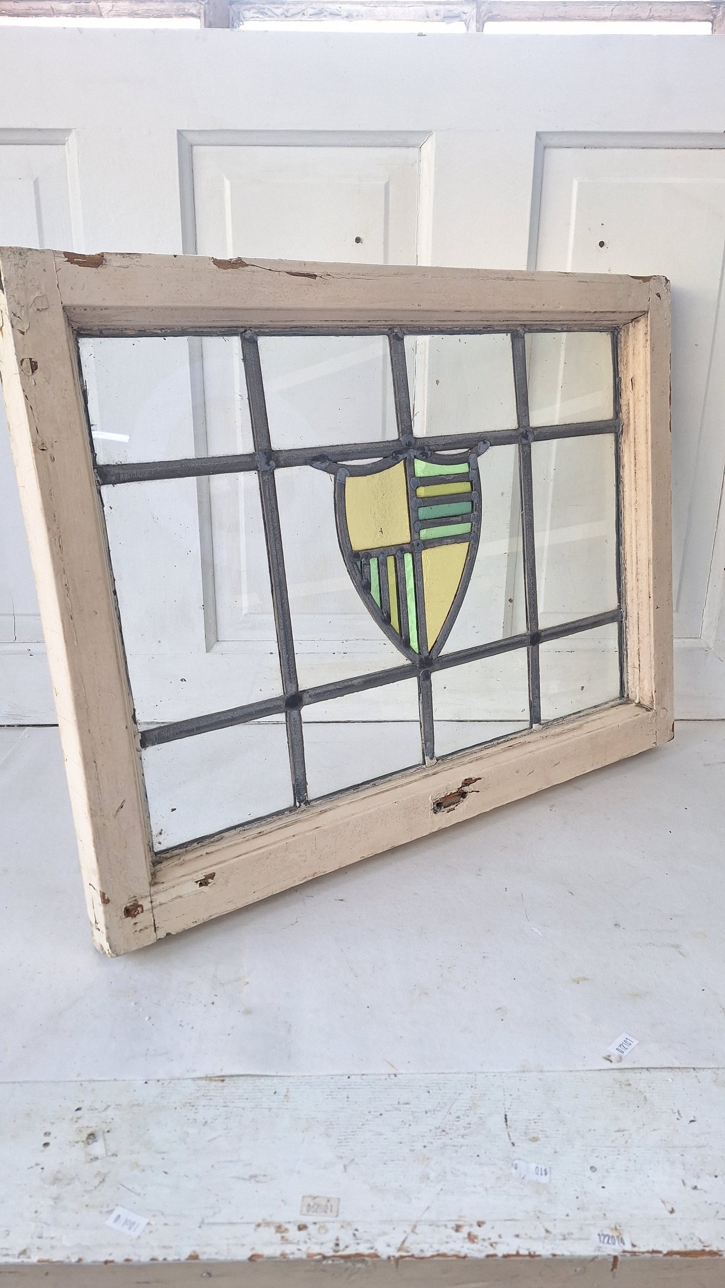 Antique Stained Glass Window: Yellow & Blue Shield Design