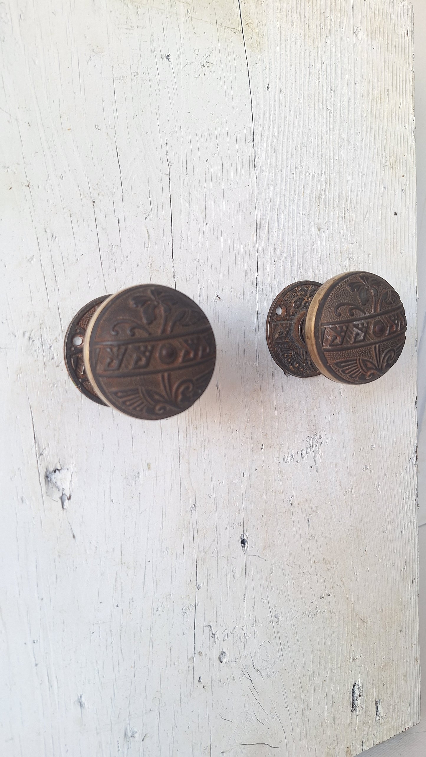 Pair Brass Banded Corbin Doorknobs with Rosettes