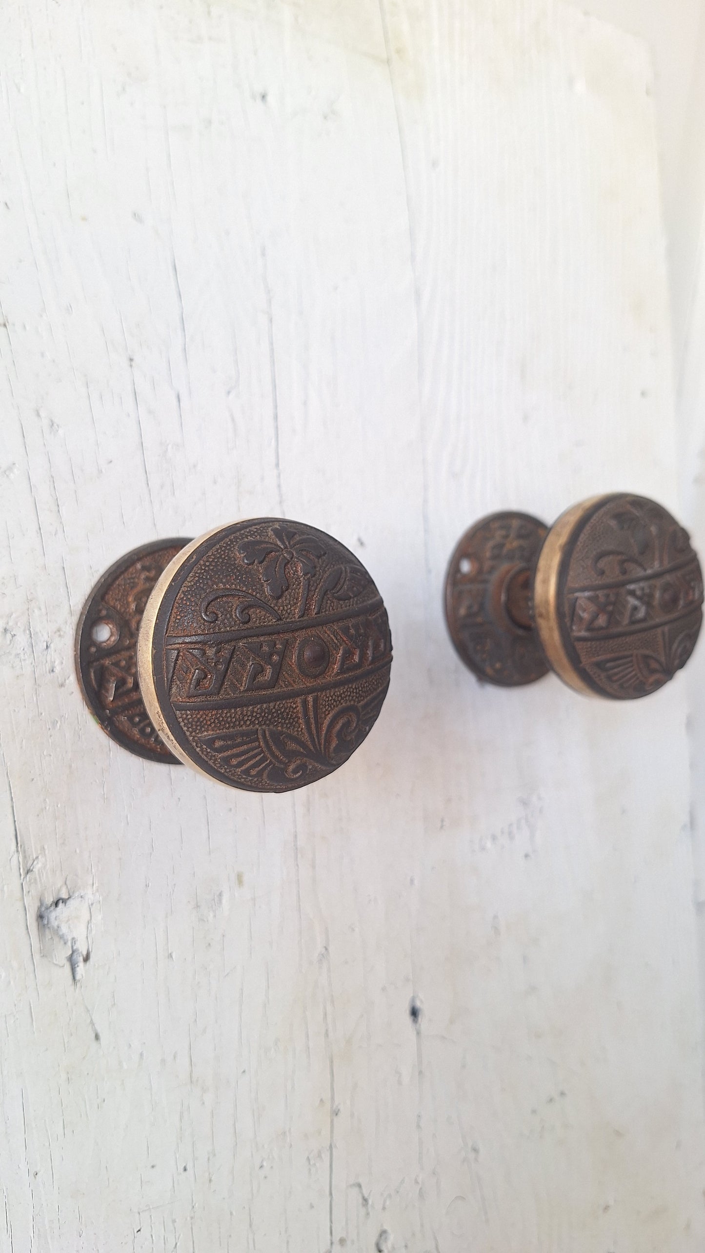 Pair Brass Banded Corbin Doorknobs with Rosettes