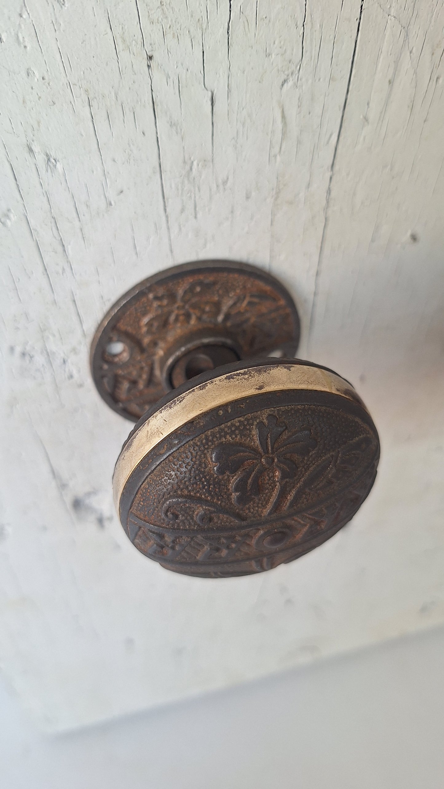 Pair Brass Banded Corbin Doorknobs with Rosettes