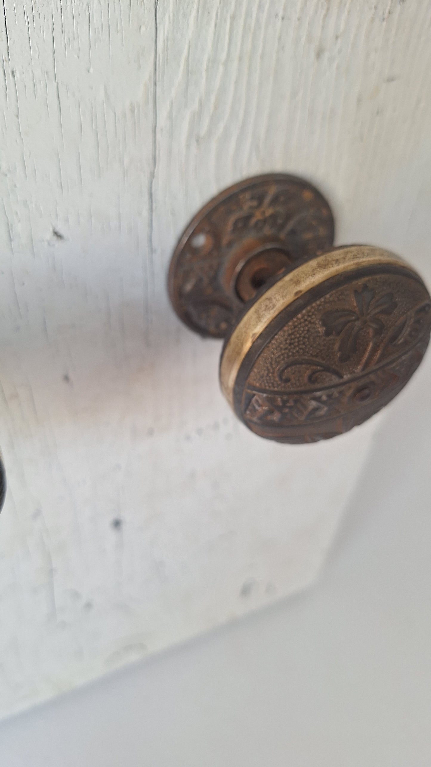 Pair Brass Banded Corbin Doorknobs with Rosettes