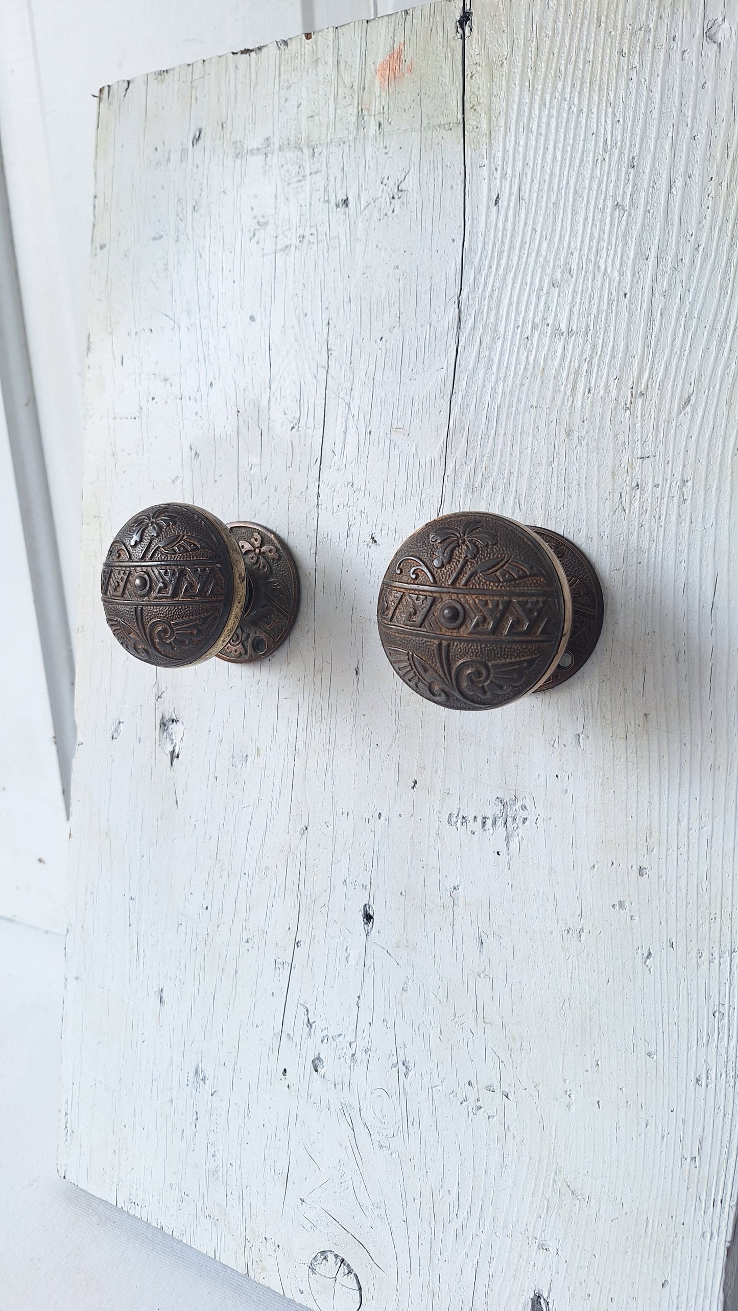 Pair Brass Banded Corbin Doorknobs with Bronze Rosettes