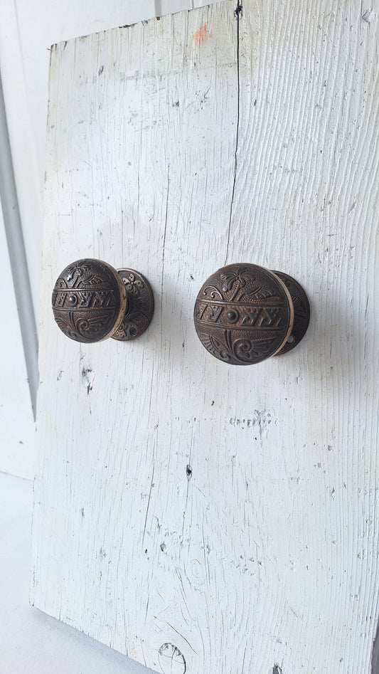 Pair Brass Banded Corbin Doorknobs with Bronze Rosettes