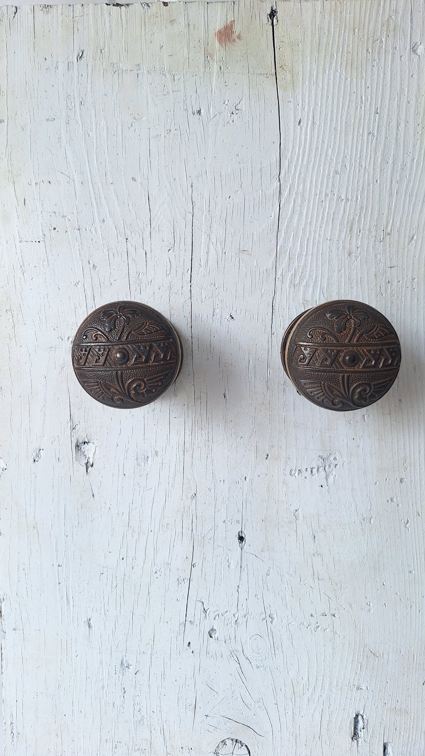 Pair Brass Banded Corbin Doorknobs with Bronze Rosettes