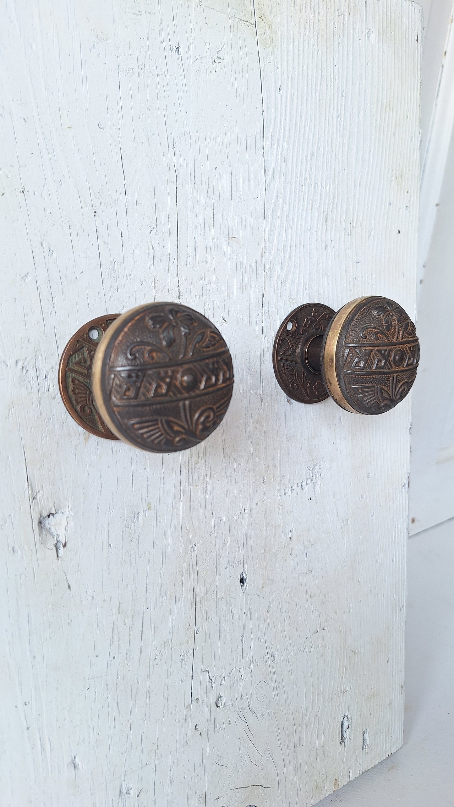 Pair Brass Banded Corbin Doorknobs with Bronze Rosettes