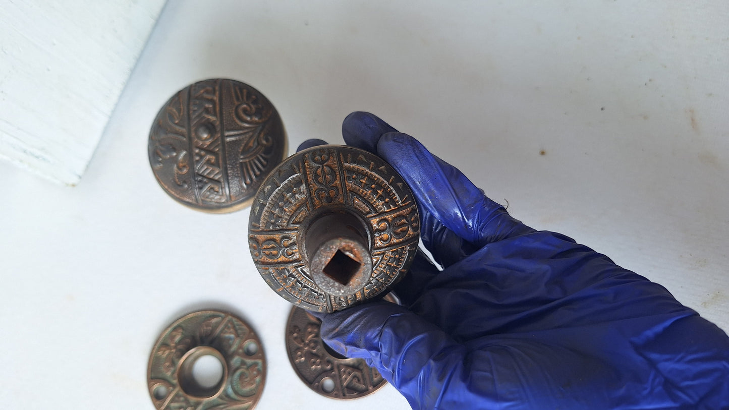 Pair Brass Banded Corbin Doorknobs with Bronze Rosettes