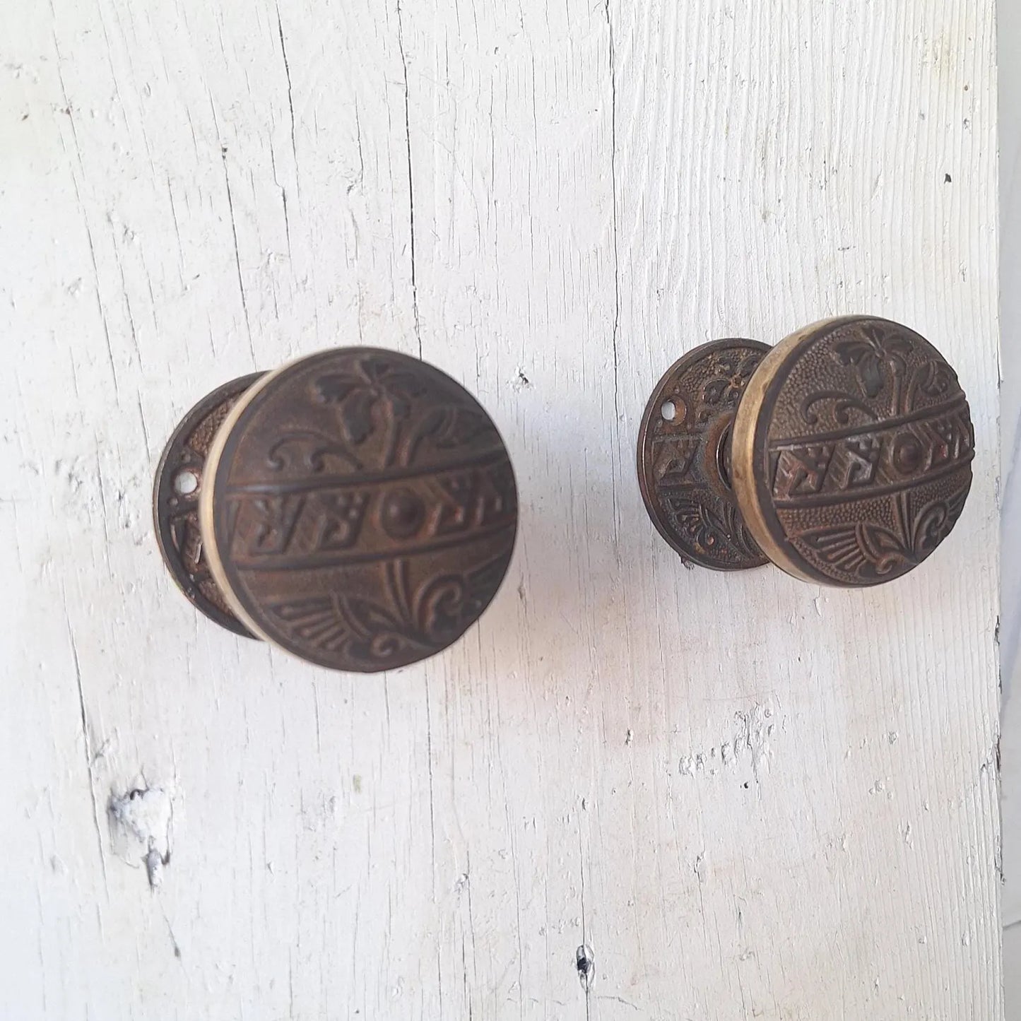 Pair Brass Banded Corbin Doorknobs with Bronze Rosettes